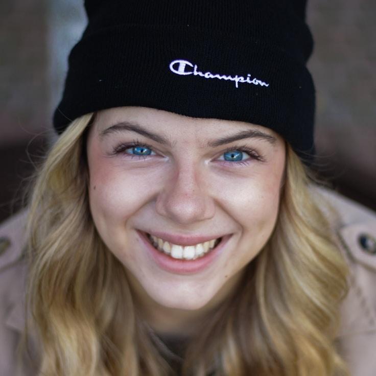 Alex Carter, Lead Design Curator at CrimsonOrbitWorkshop, reviewing corporate floral arrangements