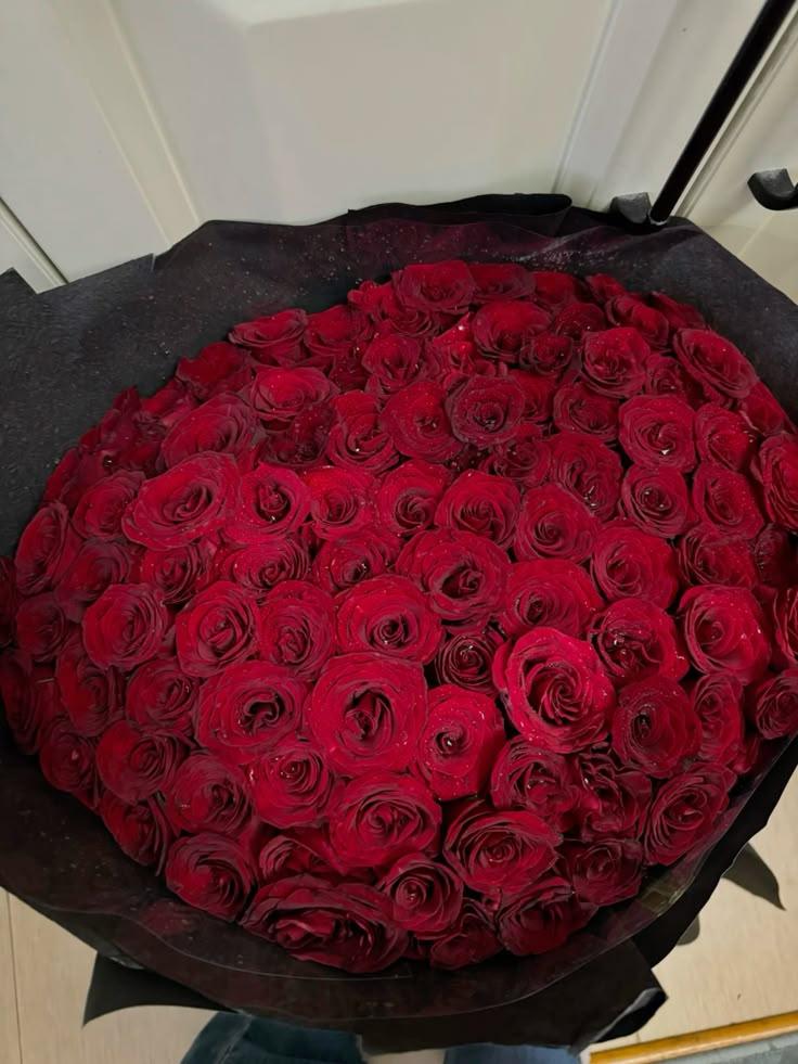 CrimsonOrbitWorkshop workshop space where corporate flower arrangements are designed and prepared for business delivery